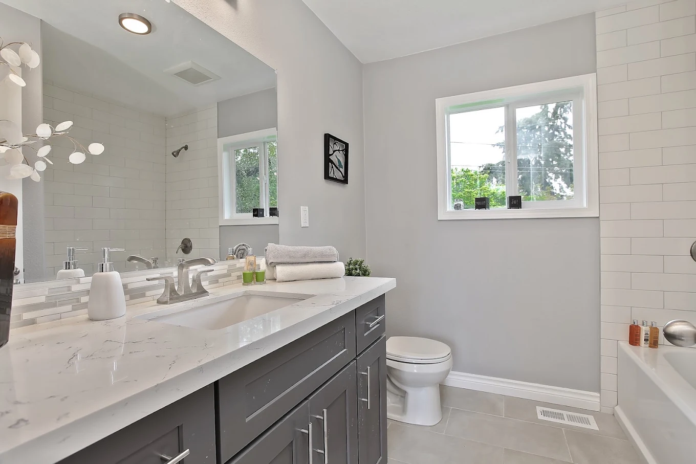 Remodeled bathroom with tiled walk-in shower in Bellevue, WA