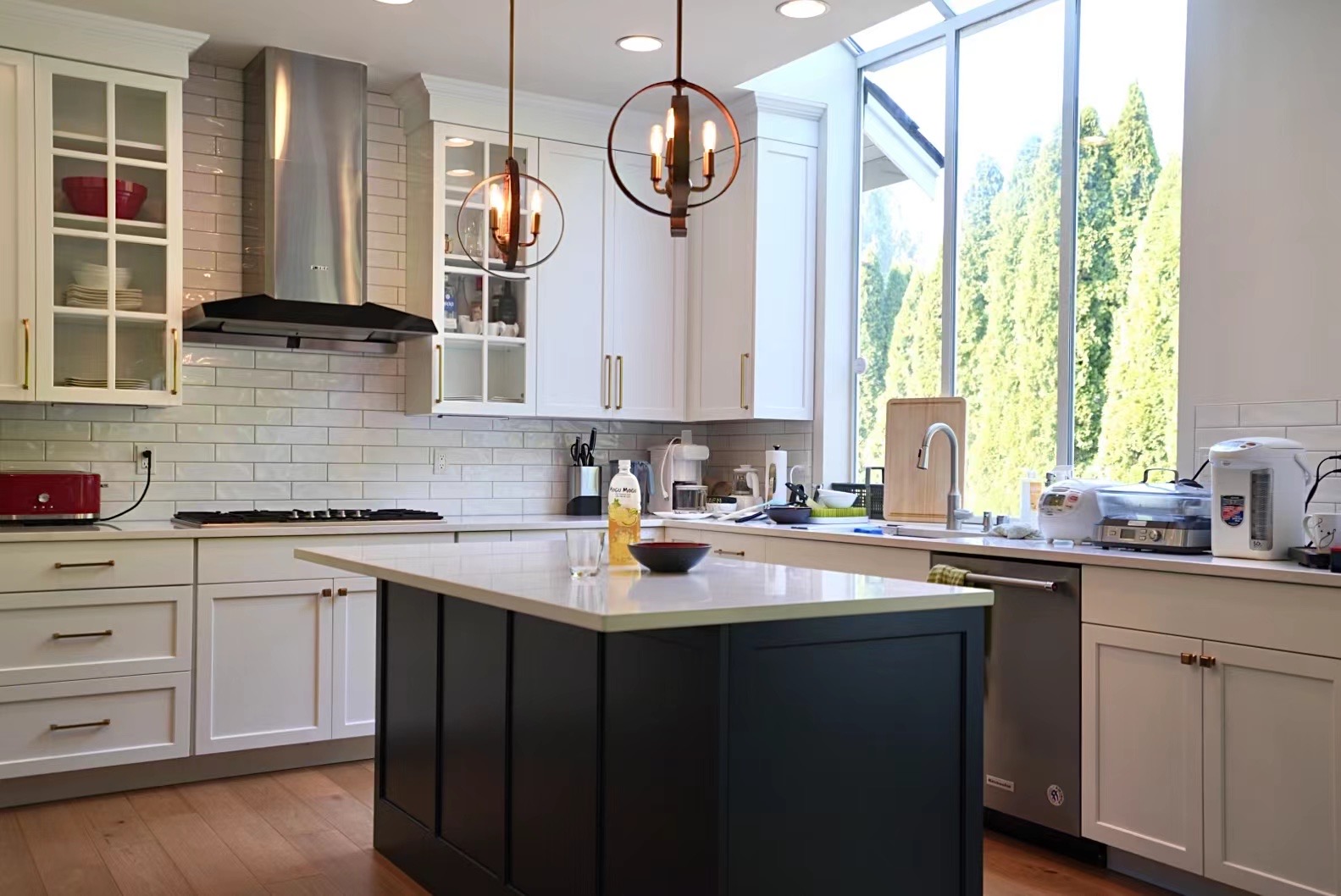 Remodeled kitchen with white cabinetry and a quartz island in a Bellevue, WA home